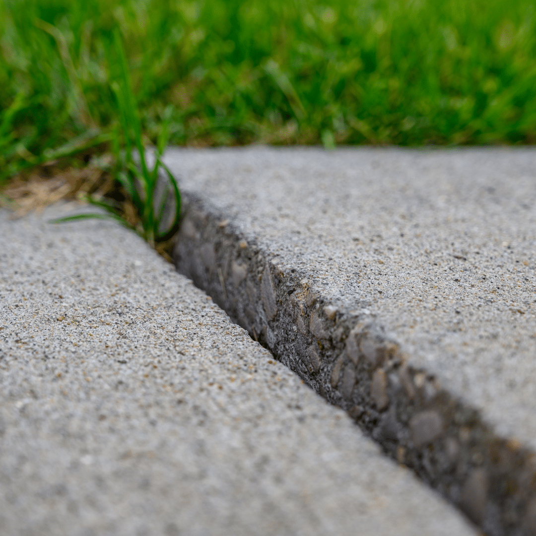 cracked, uneven concrete